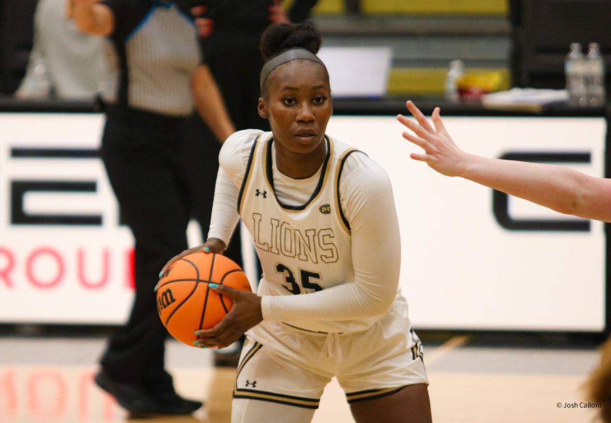 Justis Odom looks to pass the ball during a game against Bradley University.