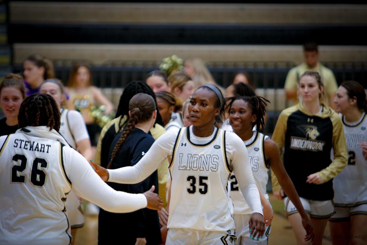 Justis Odom celebrates with Mariah Stewart after a Lindenwood win over Evansville. 