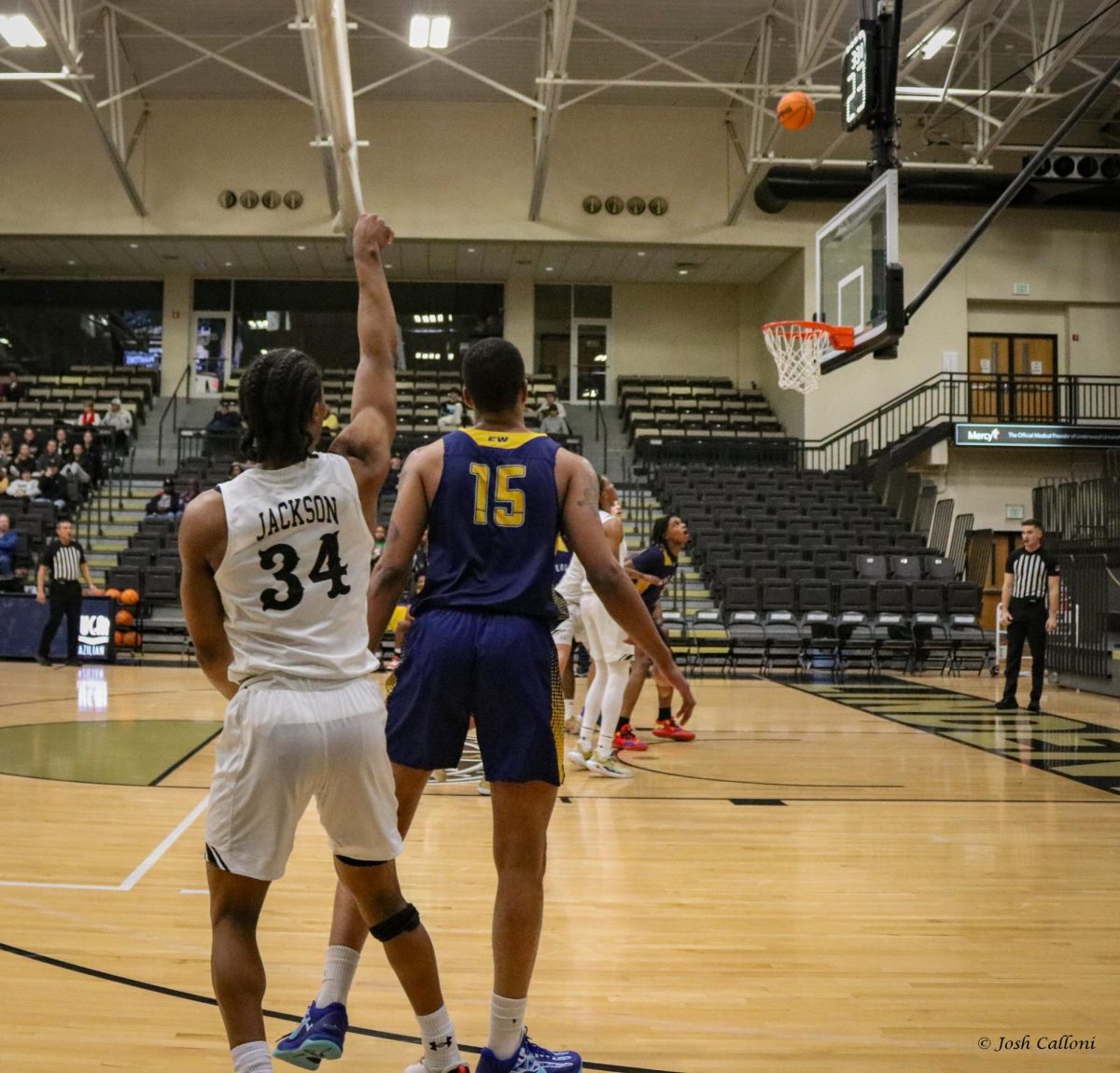 Clayton Jackson shoots a three-point attempt during a game against East-West University. 