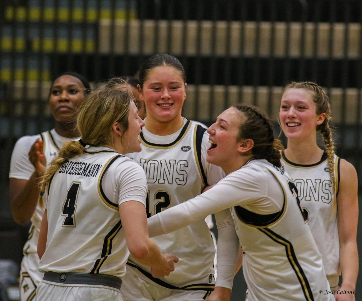 Ellie Brueggemann, Mya Skoff, Brooke Coffey and Gracy Wernli celebrate a comeback win against Western Illinois. 