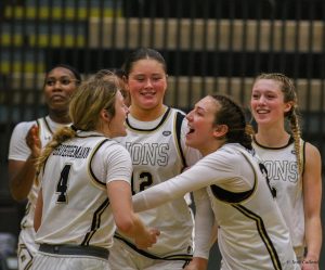 Ellie Brueggemann, Mya Skoff, Brooke Coffey and Gracy Wernli celebrate a comeback win against Western Illinois. 