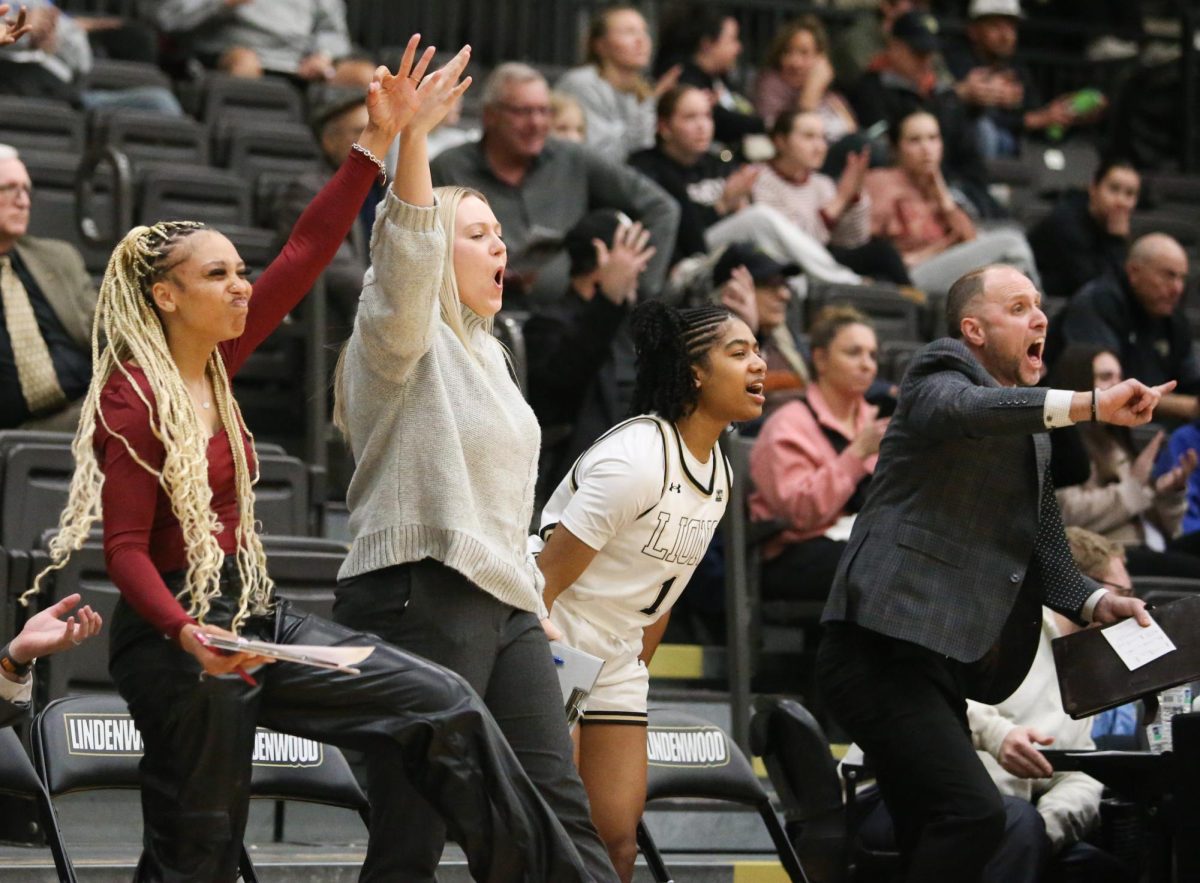 Lindenwood women's basketball team bench celebrates a three-point make.